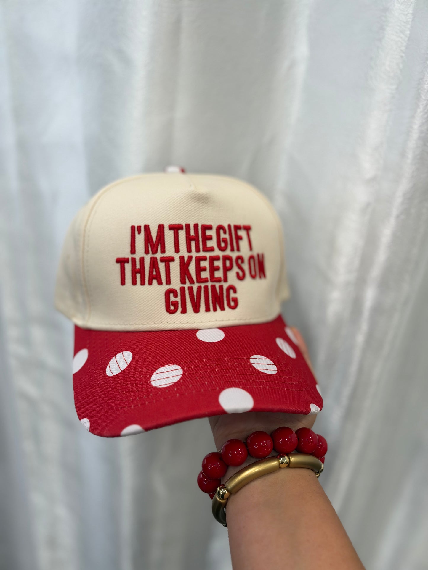 “I’m the gift” trucker hat